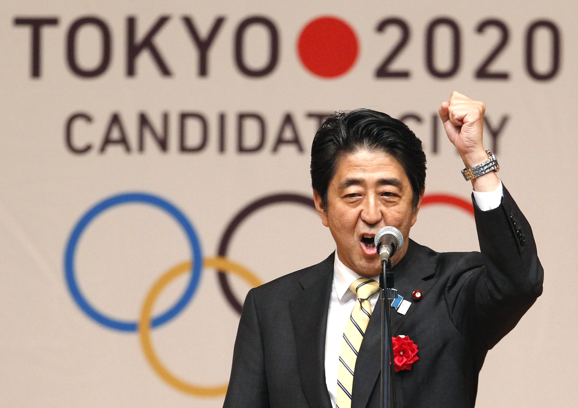 File photo of Japan's Prime Minister Shinzo Abe gesturing as he speaks during Tokyo 2020 kick off rally in Tokyo