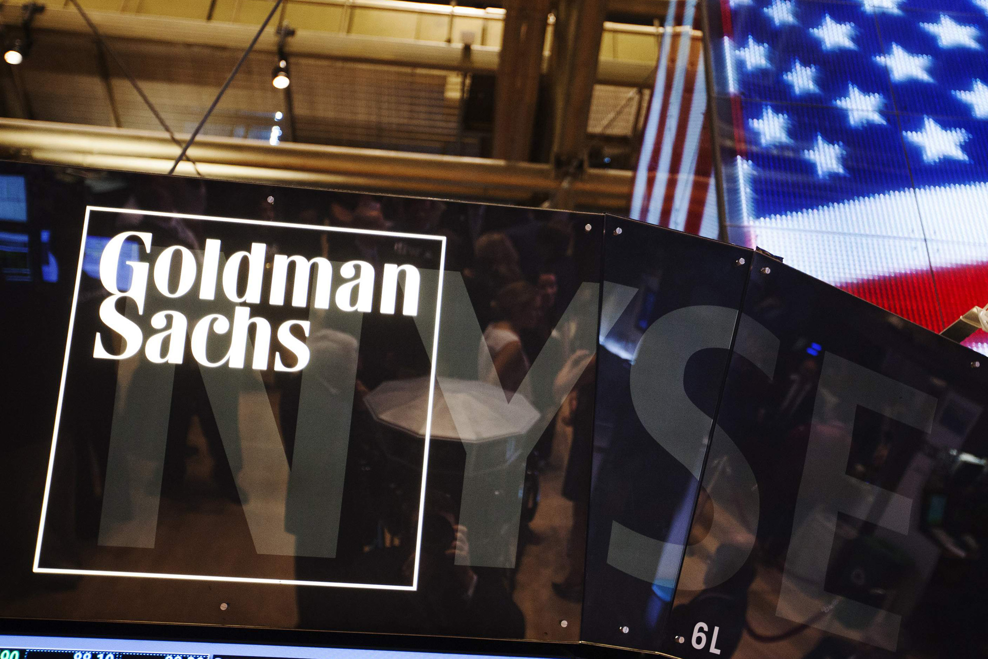 File photo of a Goldman Sachs logo displayed on a post above the floor of the New York Stock Exchange