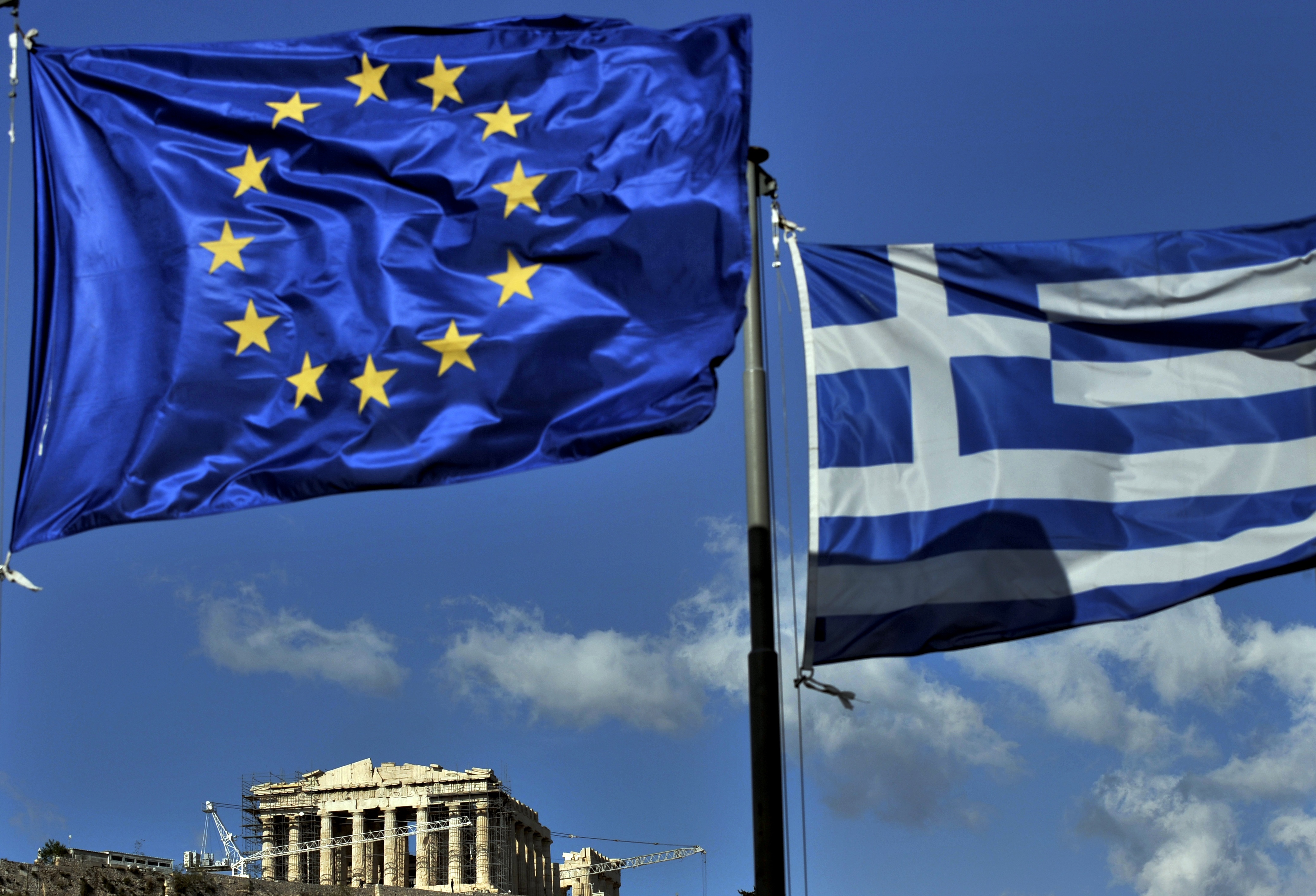 The European and the Greek flags fly abo