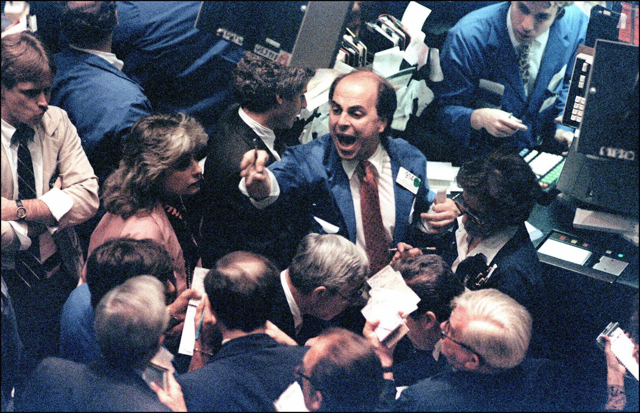 A trader (c) on the New York Stock Exchange shouts