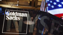 File photo of a Goldman Sachs logo displayed on a post above the floor of the New York Stock Exchange