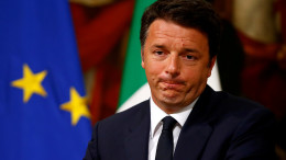 Italy Prime Minister Matteo Renzi makes a face as he talks during a news conference at Chigi Palace in Rome